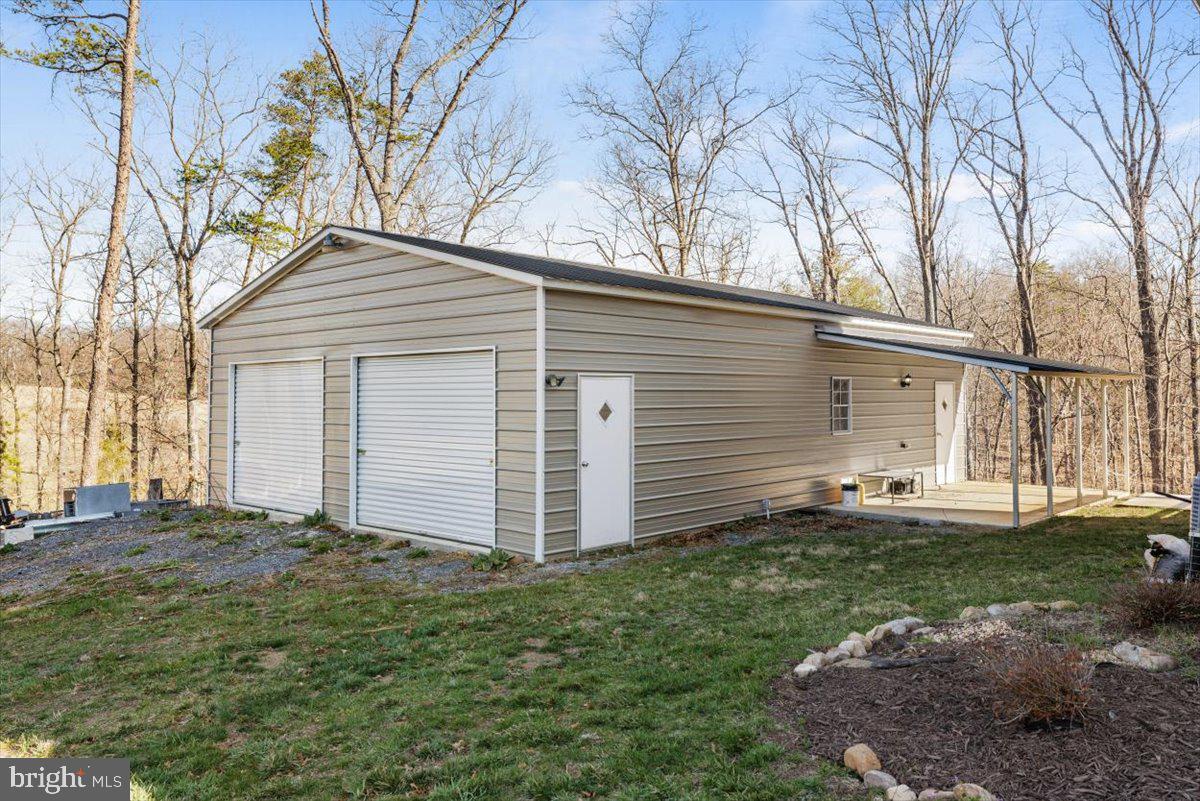 441 Shady Creek Road Clear Brook, VA 22624 - Photo 3 of 46 a front view of a house with a yard