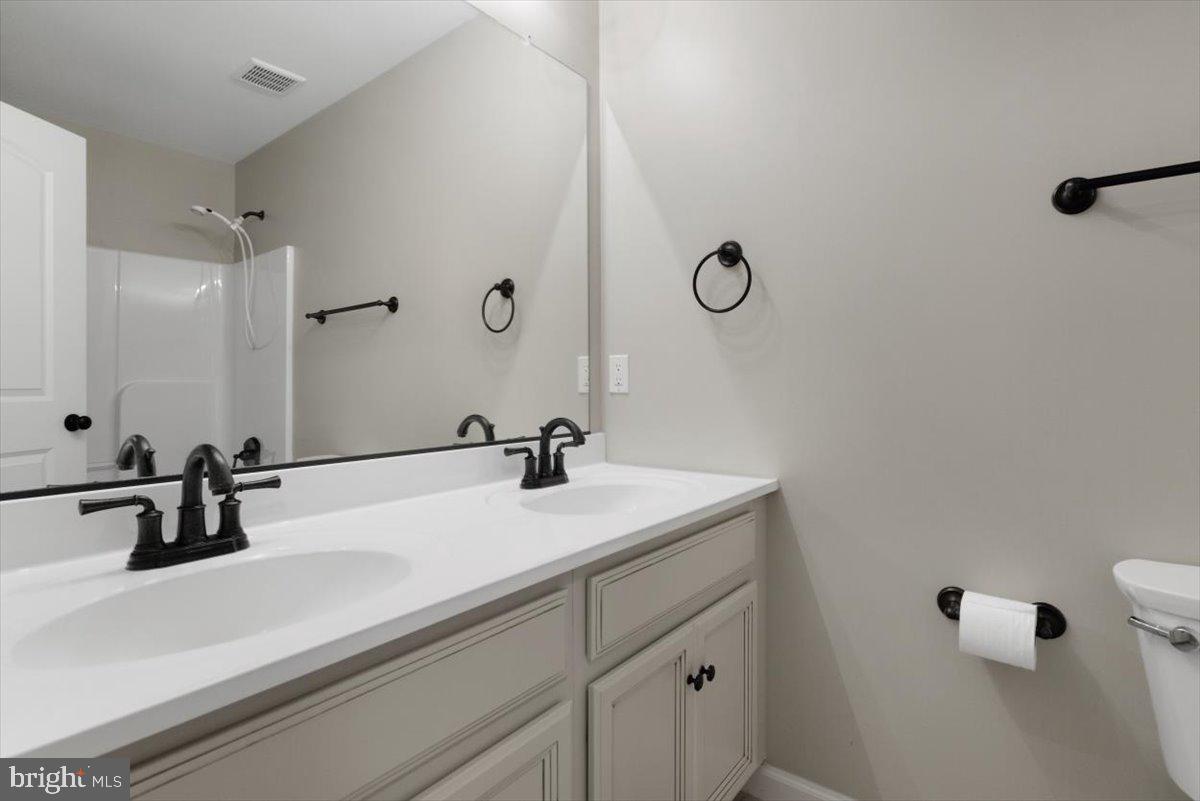 441 Shady Creek Road Clear Brook, VA 22624 - Photo 35 of 46 a bathroom with a sink and mirror
