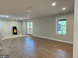 441 Shady Creek Road Clear Brook, VA 22624 - Photo 43 of 46 an empty room with wooden floor and windows