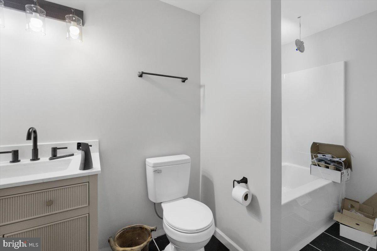 441 Shady Creek Road Clear Brook, VA 22624 - Photo 45 of 46 a white toilet sitting next to a bathroom sink