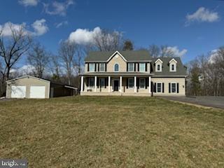 441 Shady Creek Road Clear Brook, VA 22624 - Photo 5 of 46 a front view of a house with a garden