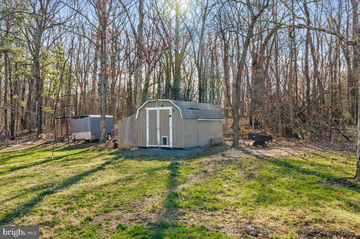 441 Shady Creek Road Clear Brook, VA 22624 - Photo 9 of 46 a view of a house with backyard and garden