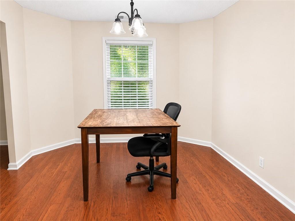 6936 Red Bone Way Stonecrest, GA 30038 - Photo 3 of 17 a view of a workspace with furniture and a window
