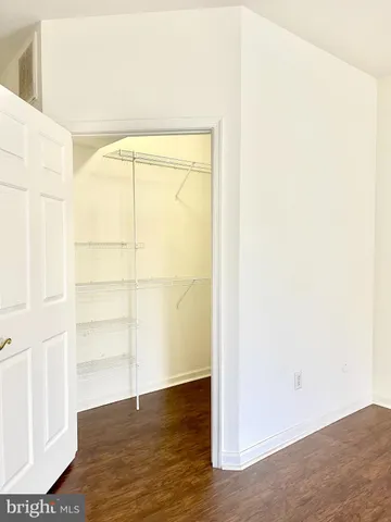 a view of a small space with wooden floor