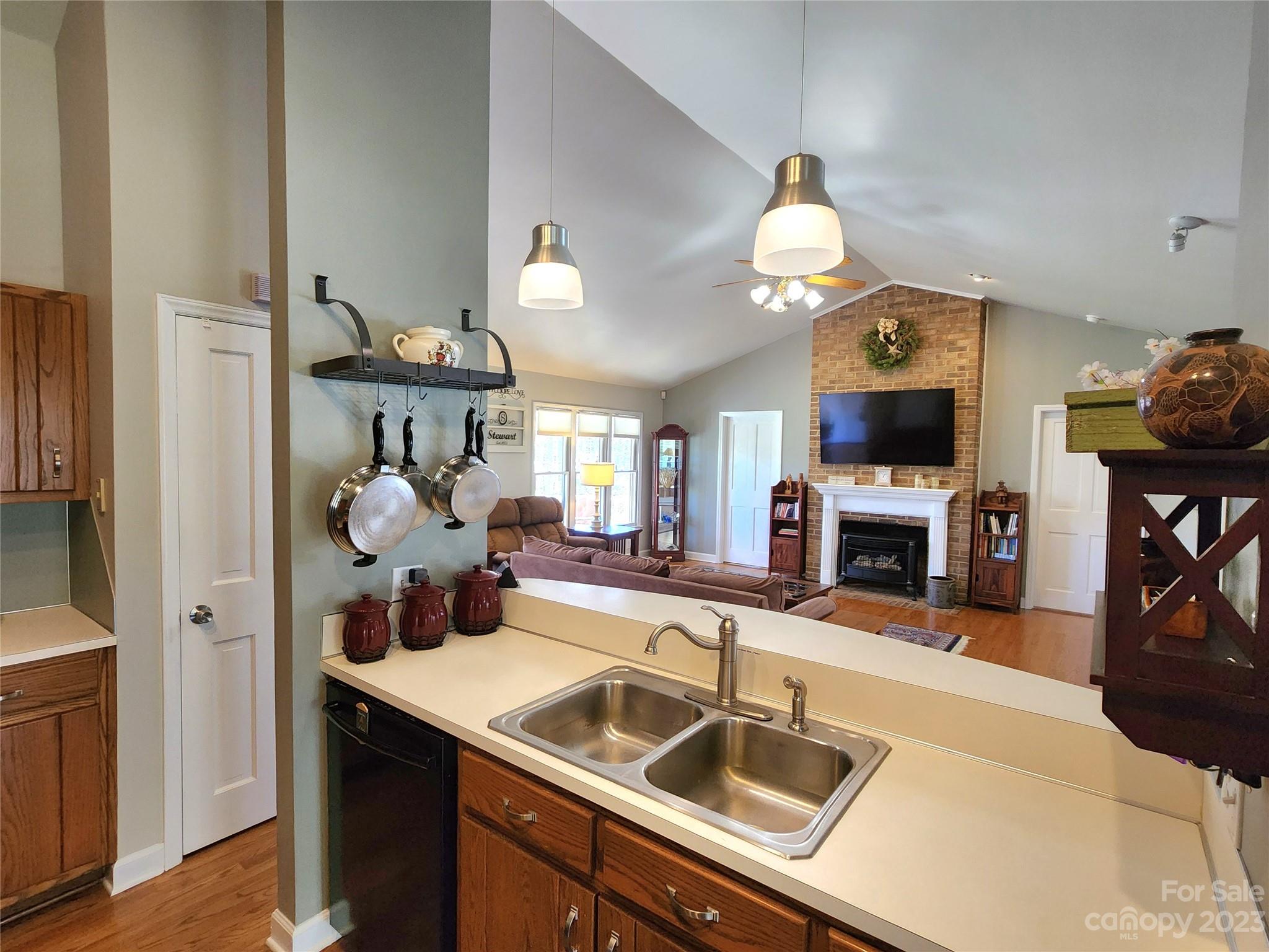 1101 Running Brook Road Midland, NC 28107 - Photo 14 of 48 a kitchen with a sink a stove and a microwave