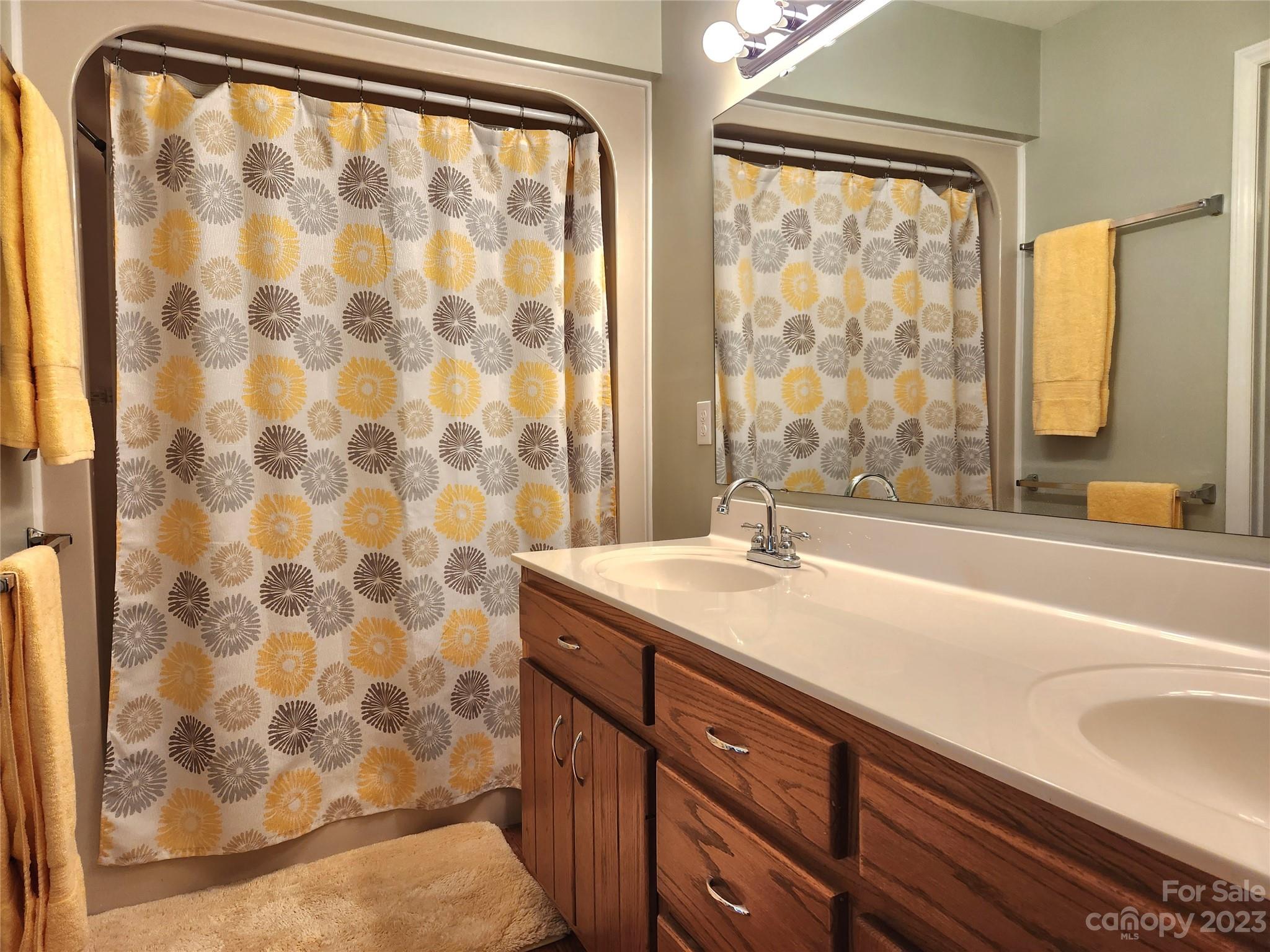 1101 Running Brook Road Midland, NC 28107 - Photo 19 of 48 a bathroom with a granite countertop sink a mirror and a shower