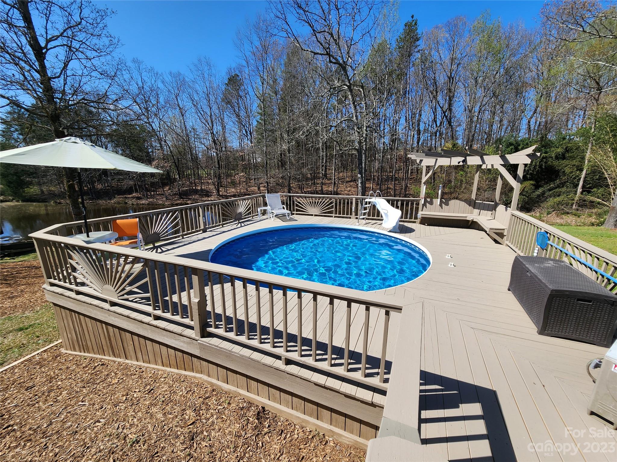 1101 Running Brook Road Midland, NC 28107 - Photo 33 of 48 a view of a patio with a table chairs and a barbeque