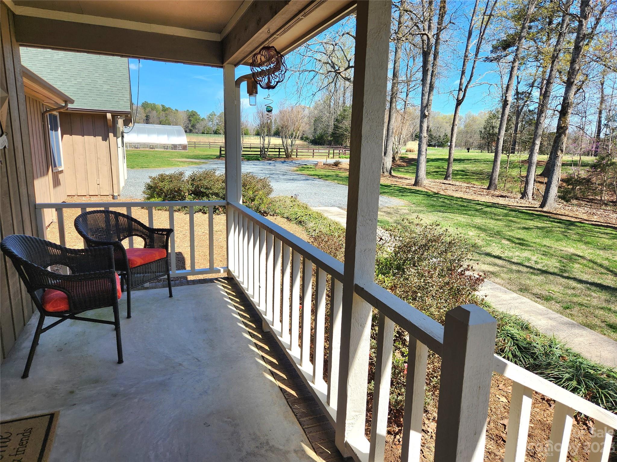1101 Running Brook Road Midland, NC 28107 - Photo 5 of 48 a view of a porch with furniture and a yard