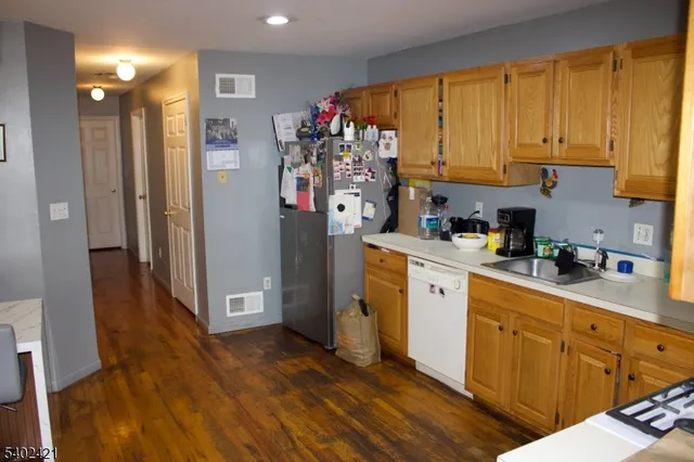a room with a flat screen tv and a fireplace