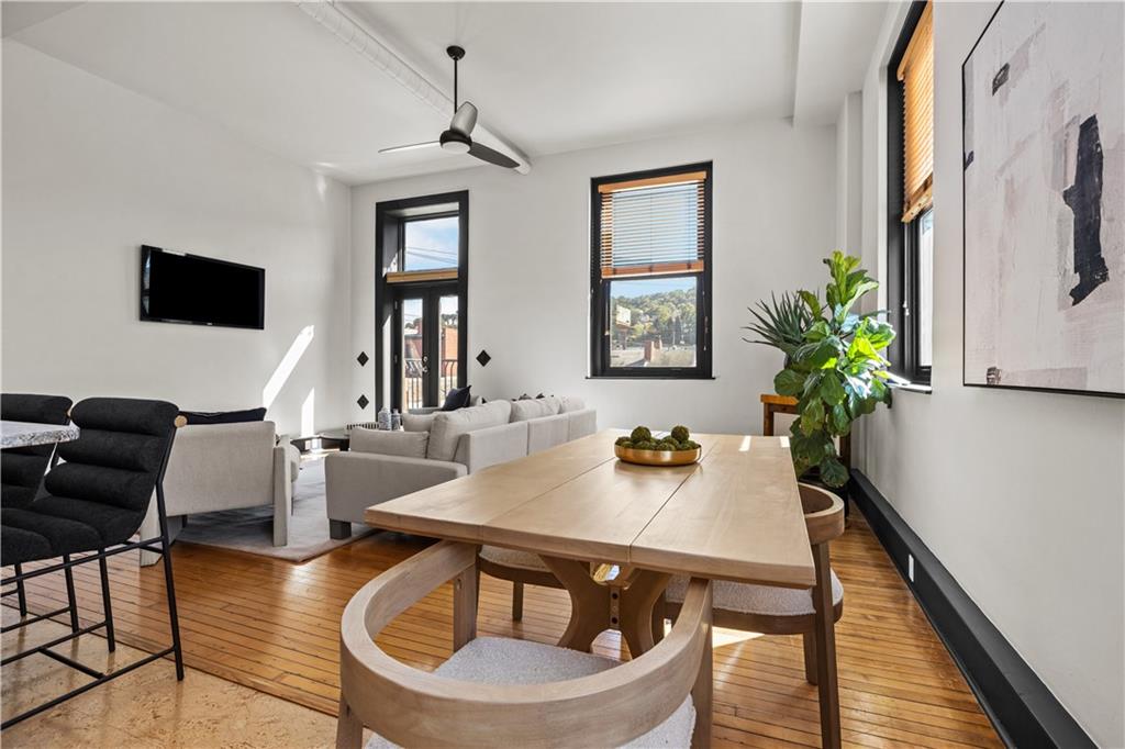 3080 Smallman Street, Unit 8 Pittsburgh, PA 15201 - Photo 17 of 39 a view of a dining room with furniture window and wooden floor