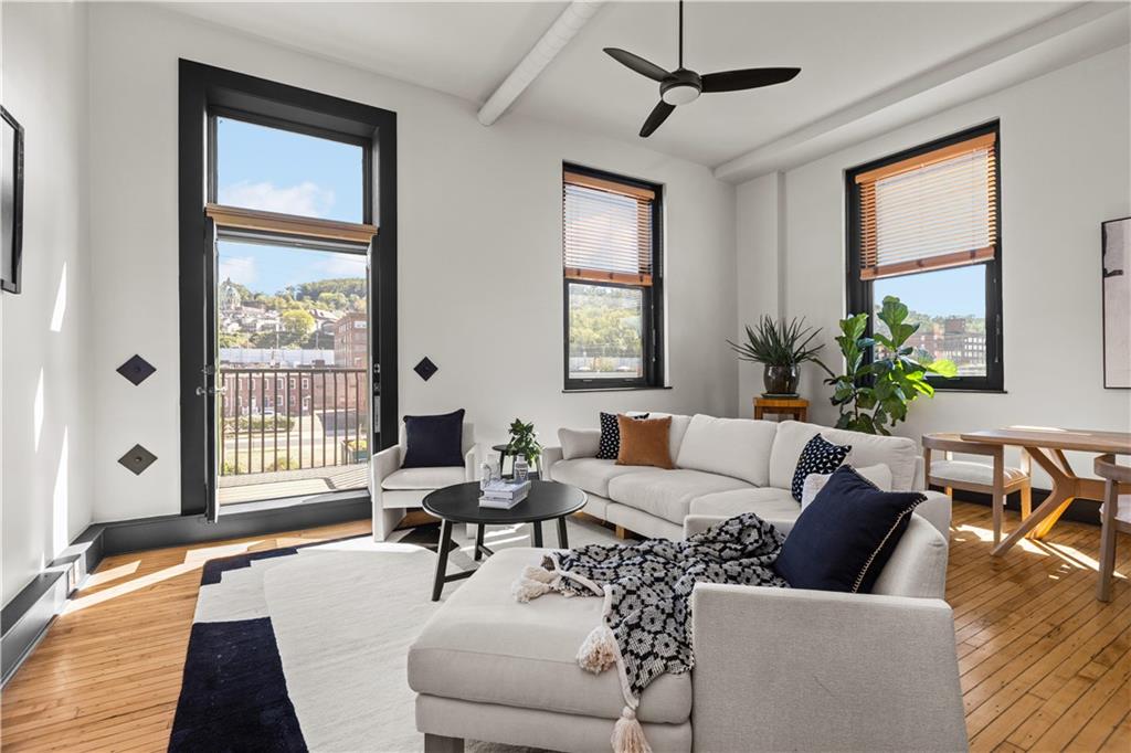 3080 Smallman Street, Unit 8 Pittsburgh, PA 15201 - Photo 19 of 39 a living room with furniture and a large window