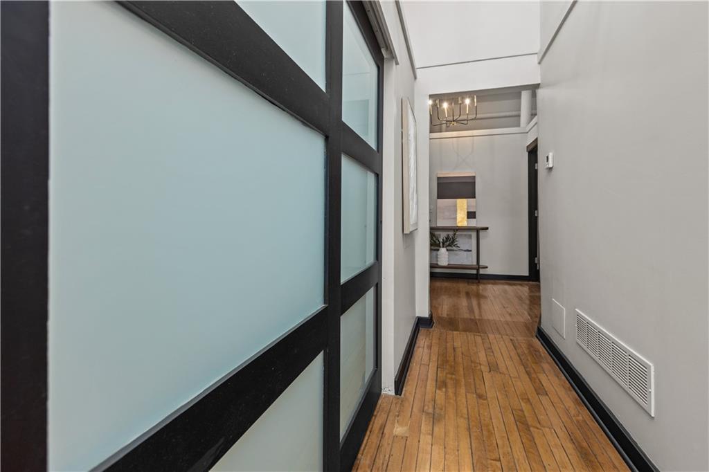 3080 Smallman Street, Unit 8 Pittsburgh, PA 15201 - Photo 22 of 39 a view of a hallway with wooden floor and staircase
