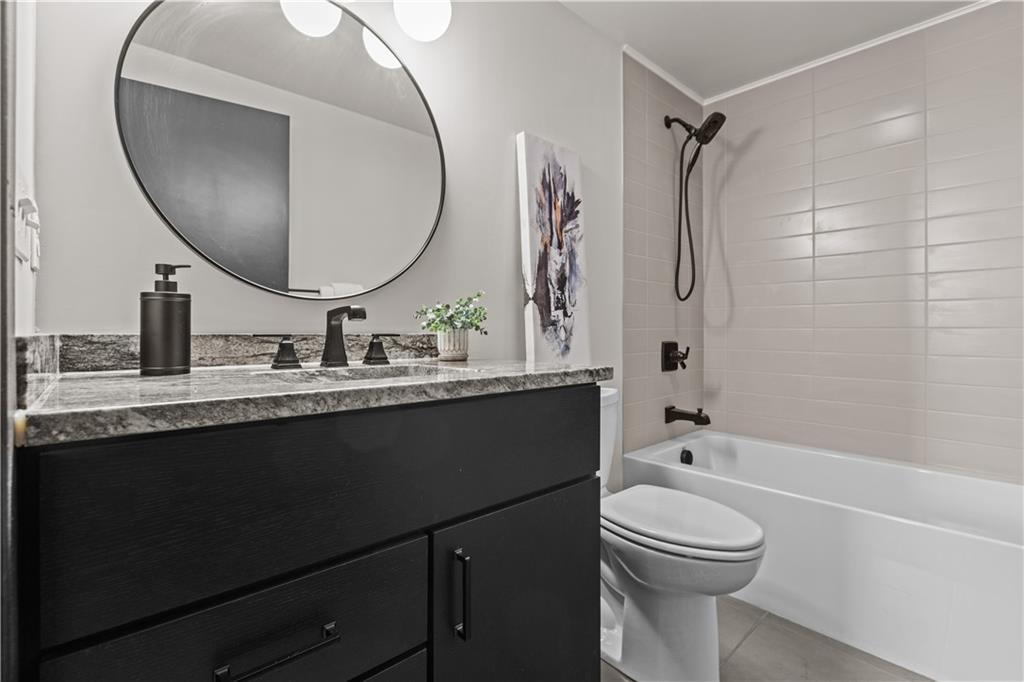 3080 Smallman Street, Unit 8 Pittsburgh, PA 15201 - Photo 24 of 39 a bathroom with a sink a toilet and a mirror