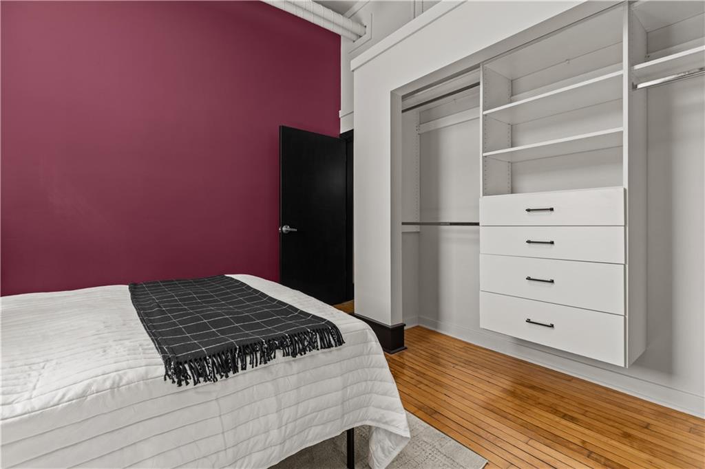 3080 Smallman Street, Unit 8 Pittsburgh, PA 15201 - Photo 30 of 39 a bedroom with a bed and a dresser