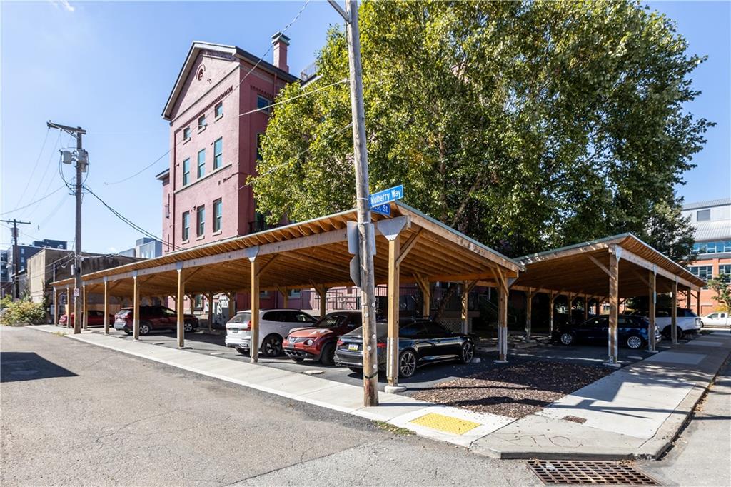 3080 Smallman Street, Unit 8 Pittsburgh, PA 15201 - Photo 32 of 39 a view of a house with a patio and a yard