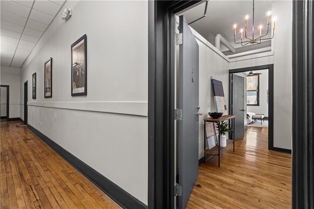 3080 Smallman Street, Unit 8 Pittsburgh, PA 15201 - Photo 8 of 39 a view of a hallway with wooden floor and staircase