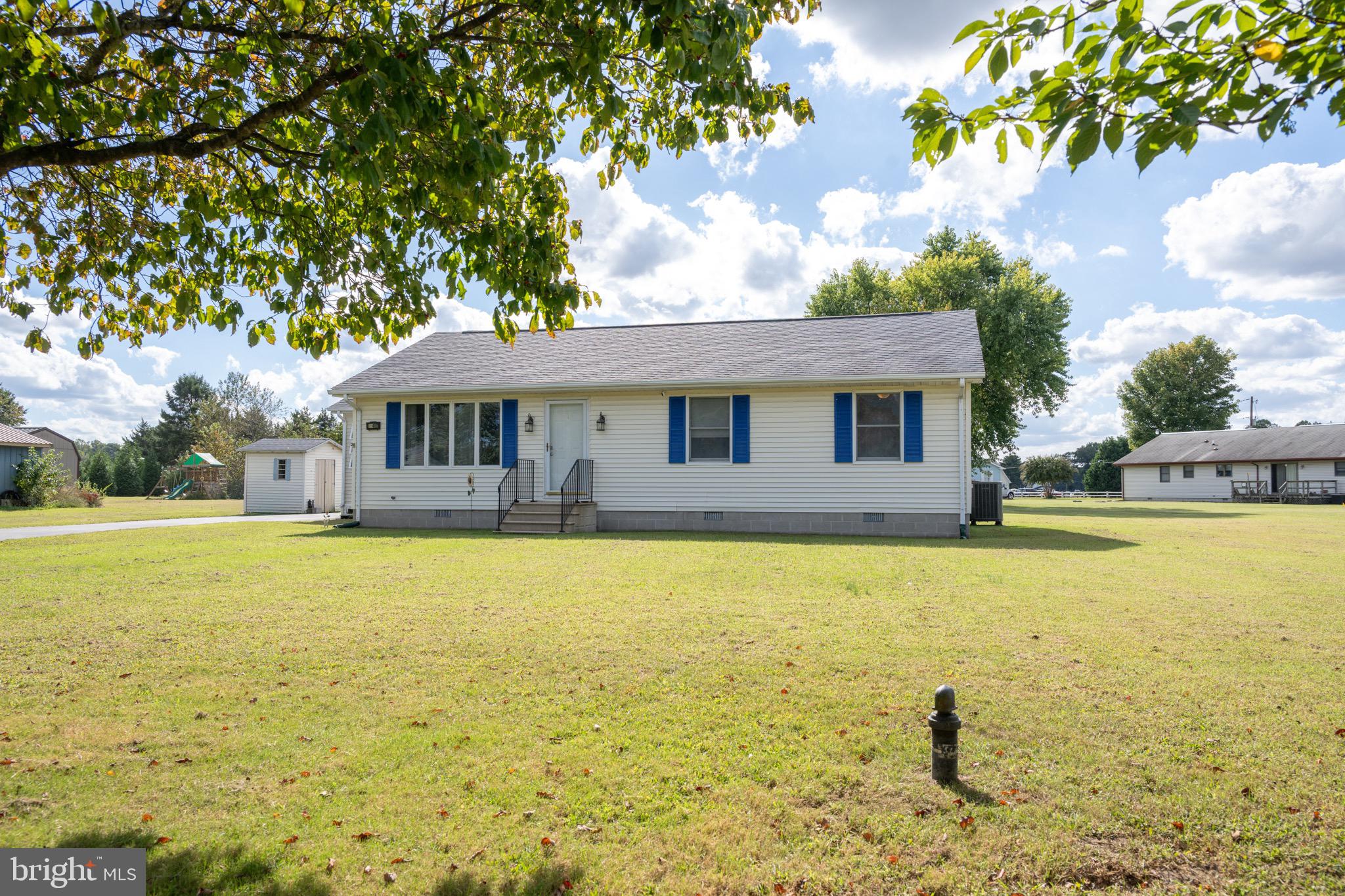 22400 Zoar Road Georgetown, DE 19947 - Photo 1 of 32 a front view of a house with swimming pool