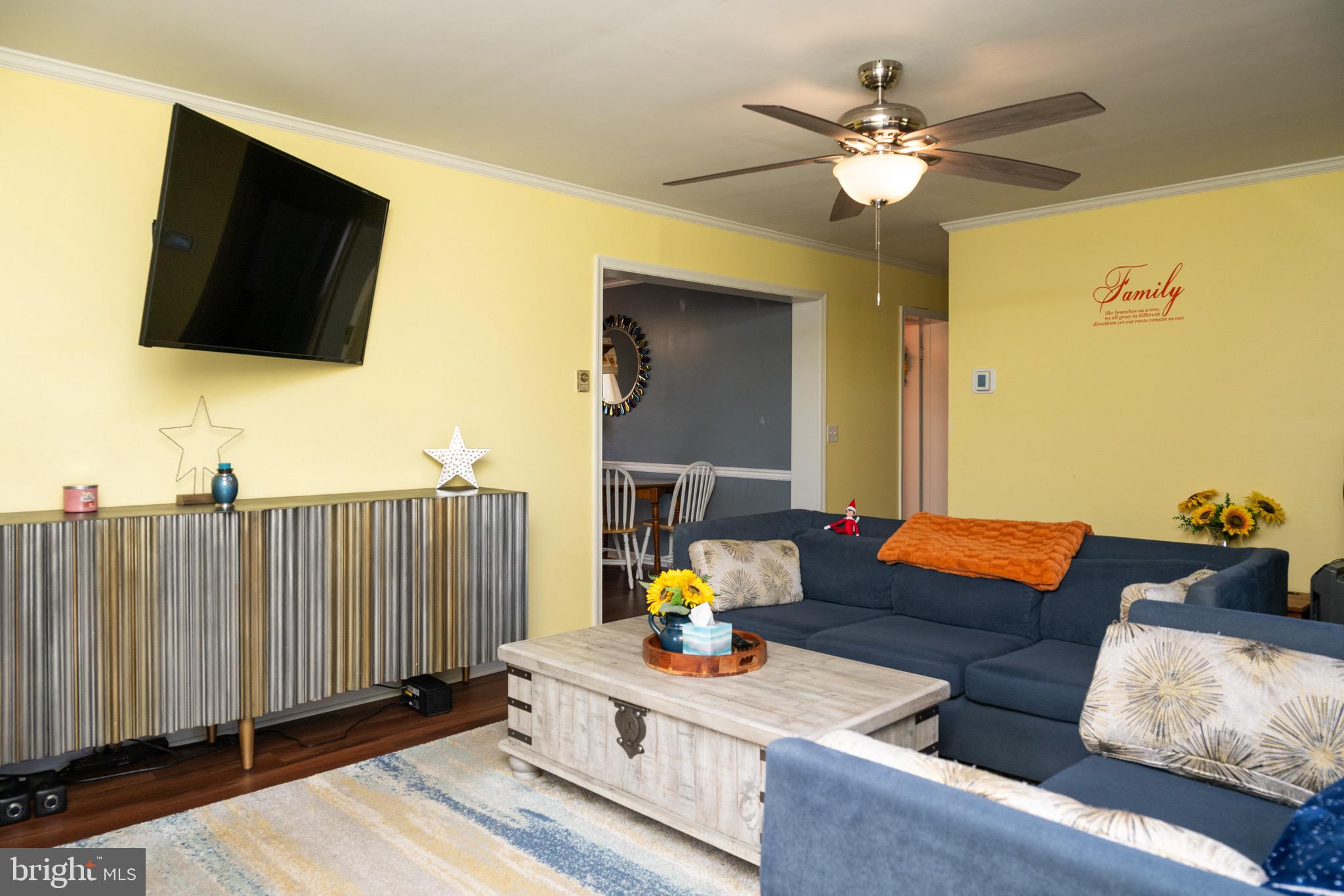 22400 Zoar Road Georgetown, DE 19947 - Photo 14 of 32 a living room with furniture and a flat screen tv