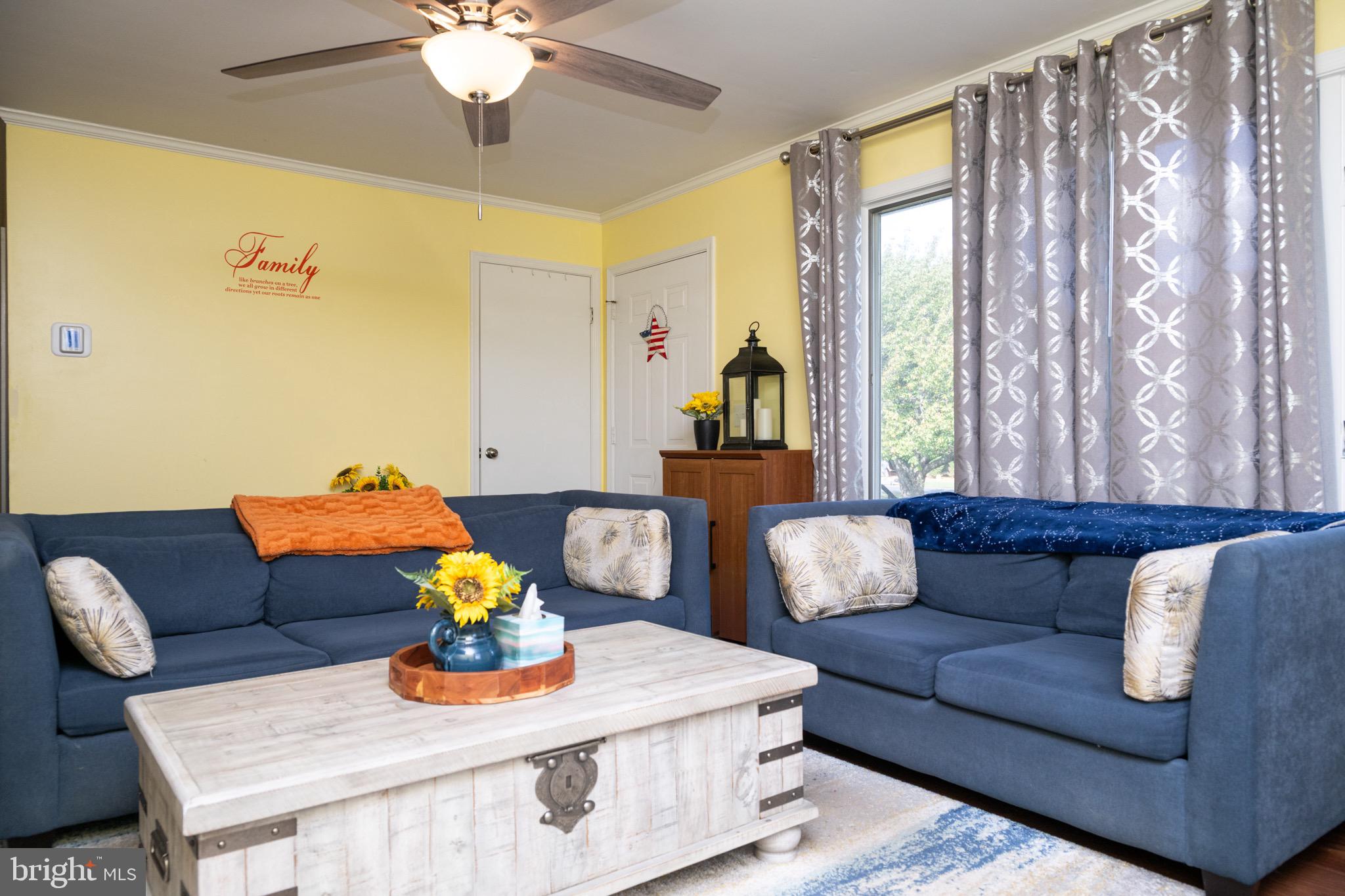 22400 Zoar Road Georgetown, DE 19947 - Photo 15 of 32 a living room with furniture and a large window