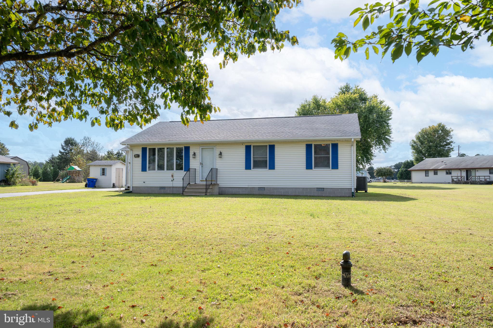 22400 Zoar Road Georgetown, DE 19947 - Photo 2 of 32 a front view of a house with swimming pool