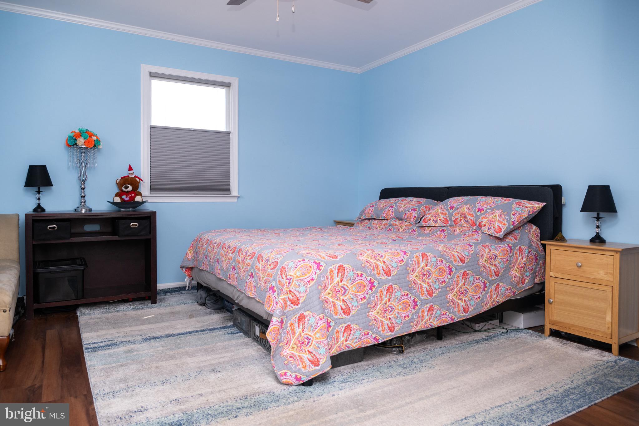 22400 Zoar Road Georgetown, DE 19947 - Photo 26 of 32 a bedroom with a bed and a dresser