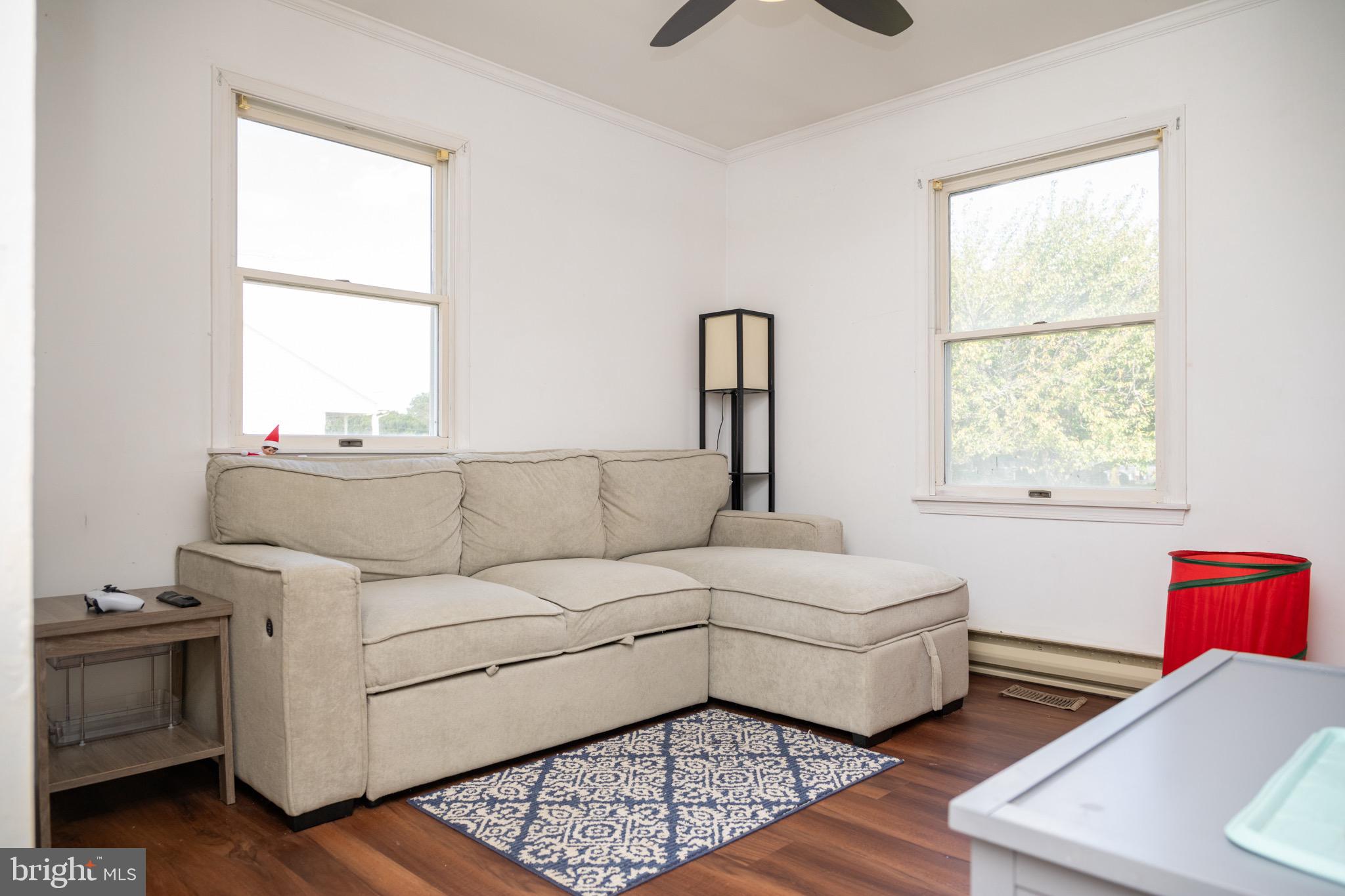 22400 Zoar Road Georgetown, DE 19947 - Photo 28 of 32 a living room with furniture and a window