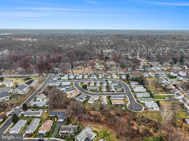 an aerial view of city and mountain