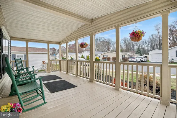 a view of a patio with wooden floor