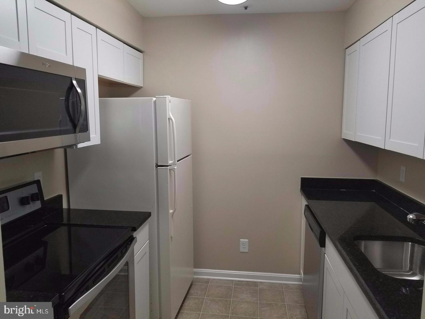 4934 Columbia Road, Unit 458 Columbia, MD 21044 - Photo 11 of 21 Modern kitchen with sleek finishes.