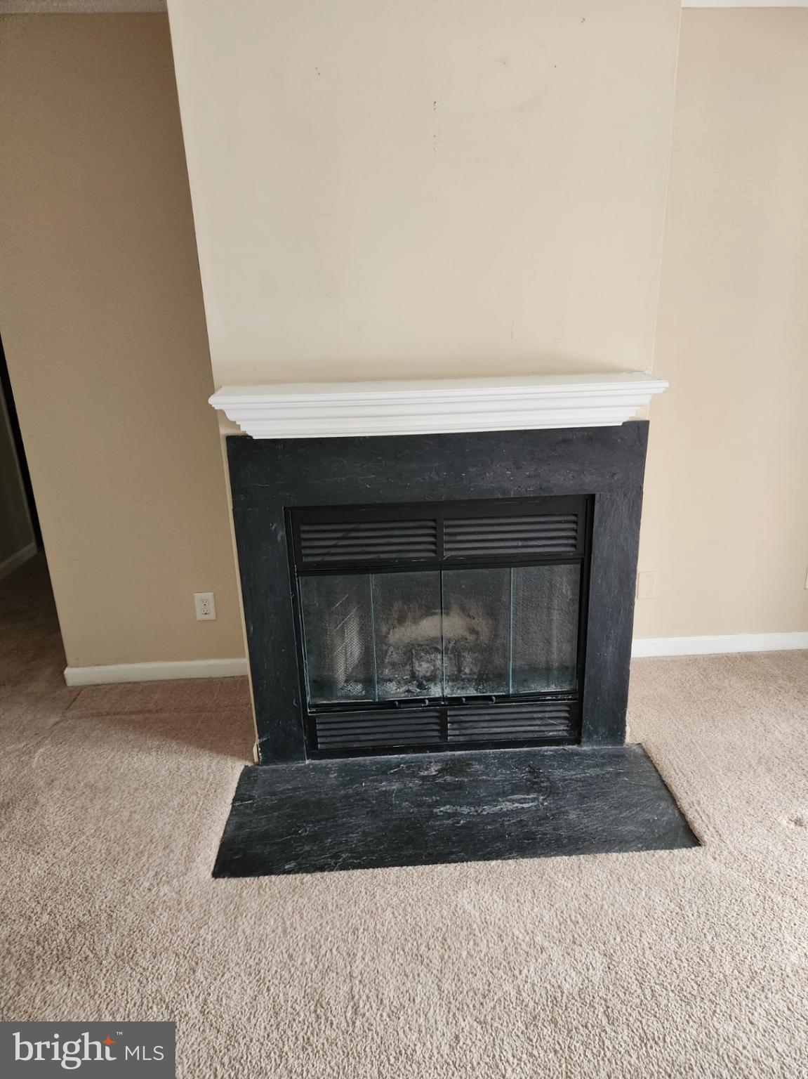 4934 Columbia Road, Unit 458 Columbia, MD 21044 - Photo 17 of 21 Cozy fireplace ready for winter warmth.