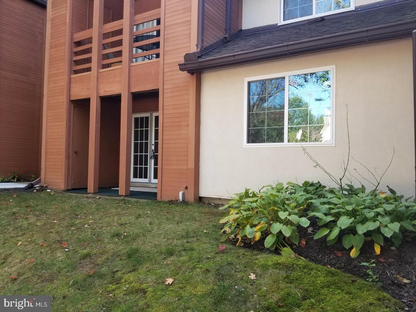 4934 Columbia Road, Unit 458 Columbia, MD 21044 - Photo 3 of 21 Charming exterior with lush greenery.