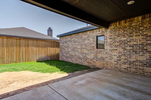 a view of a backyard with a garden and plants