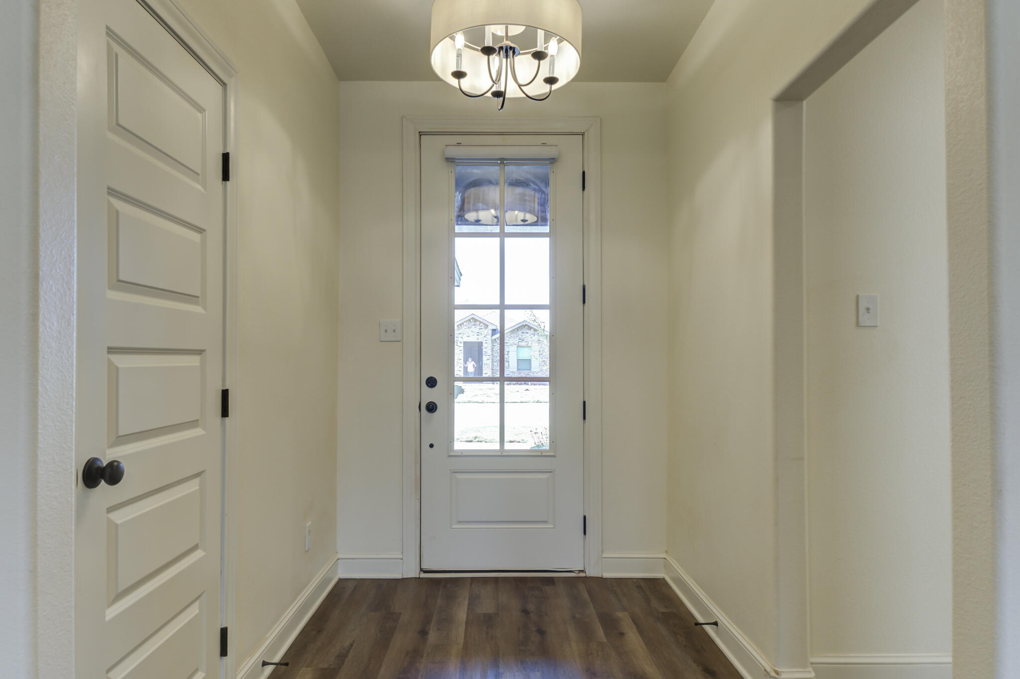 6908 55th Street Lubbock, TX 79407 - Photo 4 of 42 a view of an entryway with wooden floor