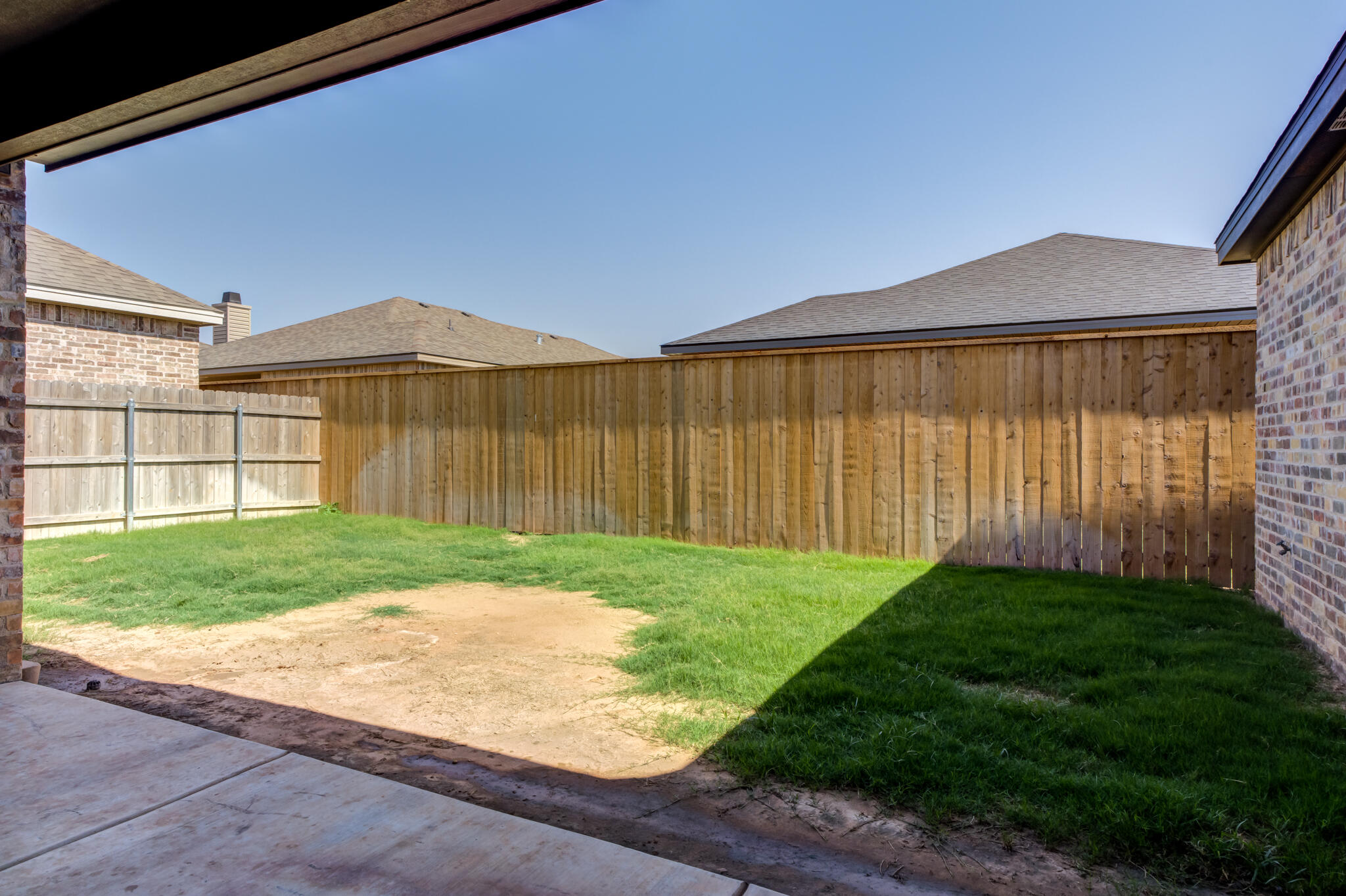 6908 55th Street Lubbock, TX 79407 - Photo 41 of 42 a view of a backyard with a garden and plants