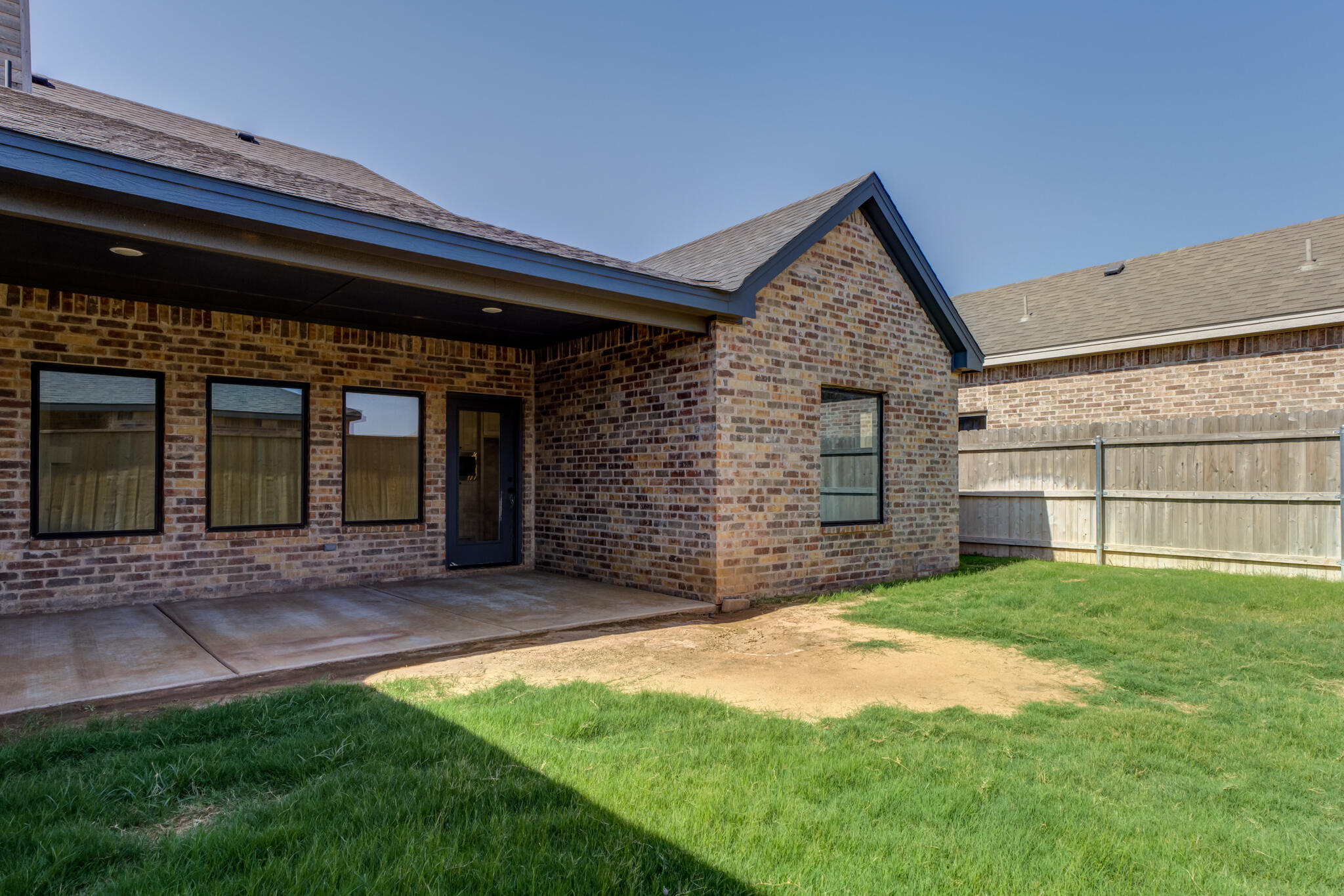 6908 55th Street Lubbock, TX 79407 - Photo 42 of 42 a front view of a house with a yard