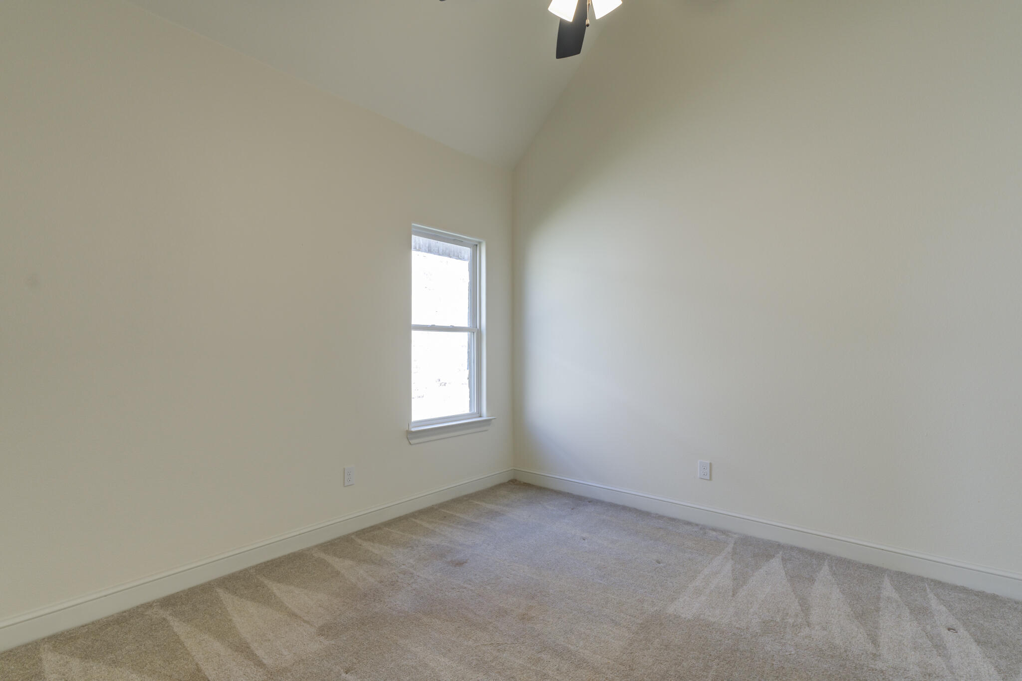 6908 55th Street Lubbock, TX 79407 - Photo 5 of 42 an empty room with a window