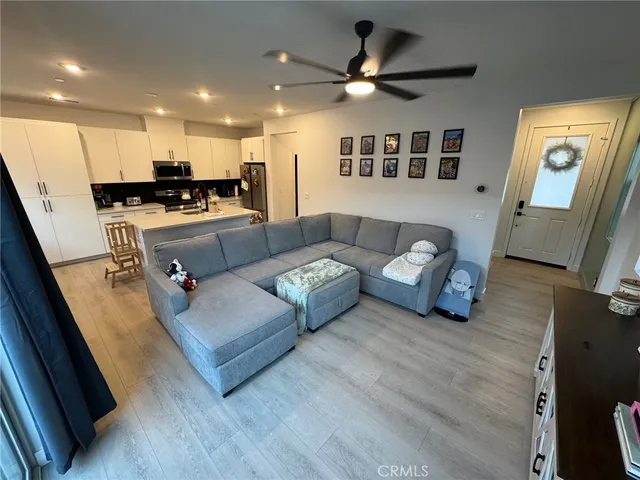 a kitchen with stainless steel appliances granite countertop a sink and a stove