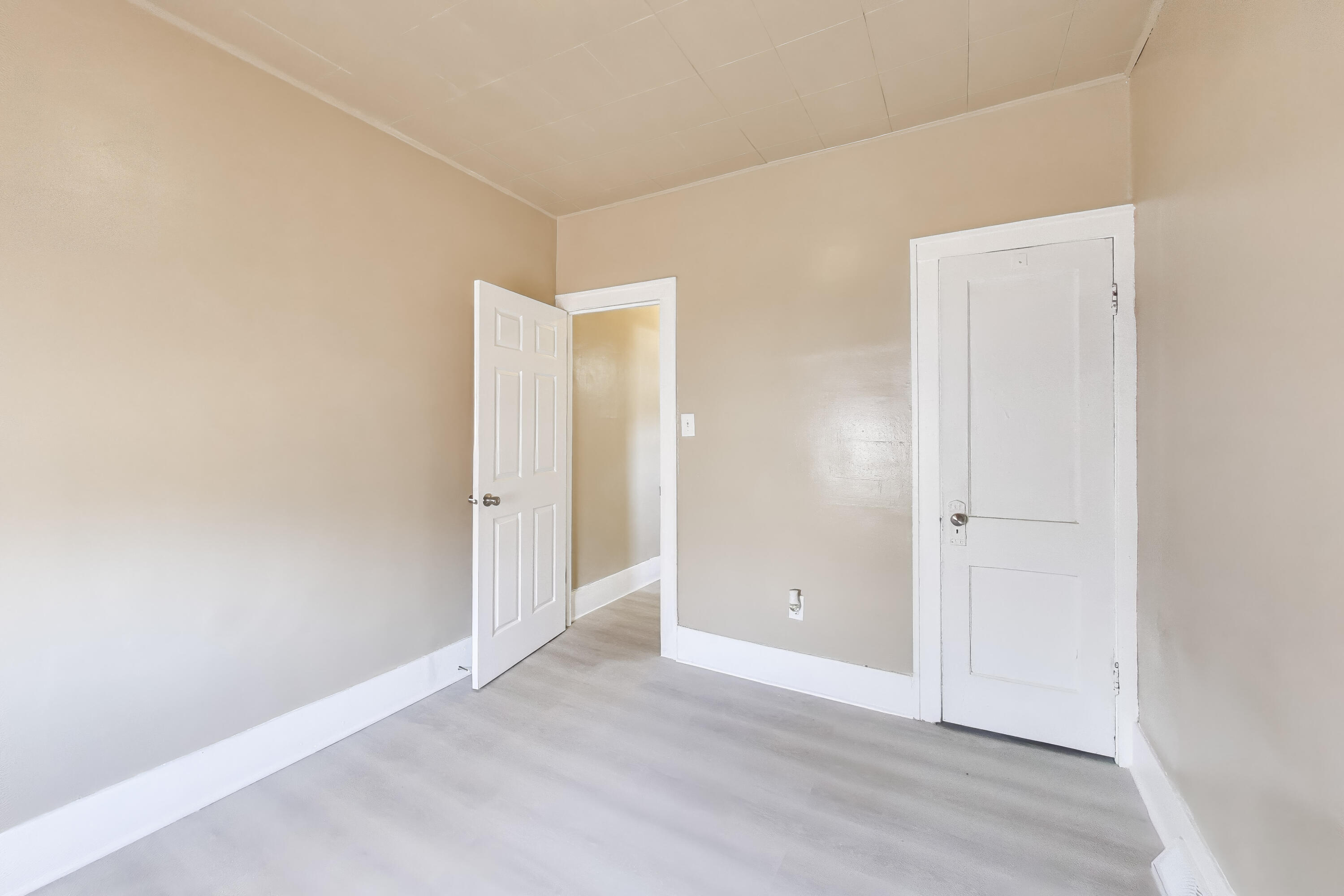 329 Pierce Street Gary, IN 46402 - Photo 15 of 17 an empty room with wooden floor