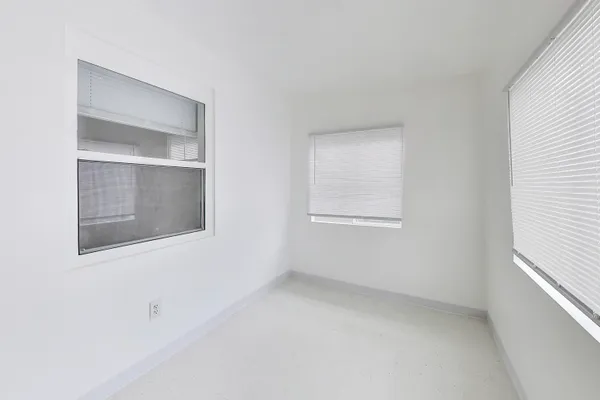 a view of an empty room with a window
