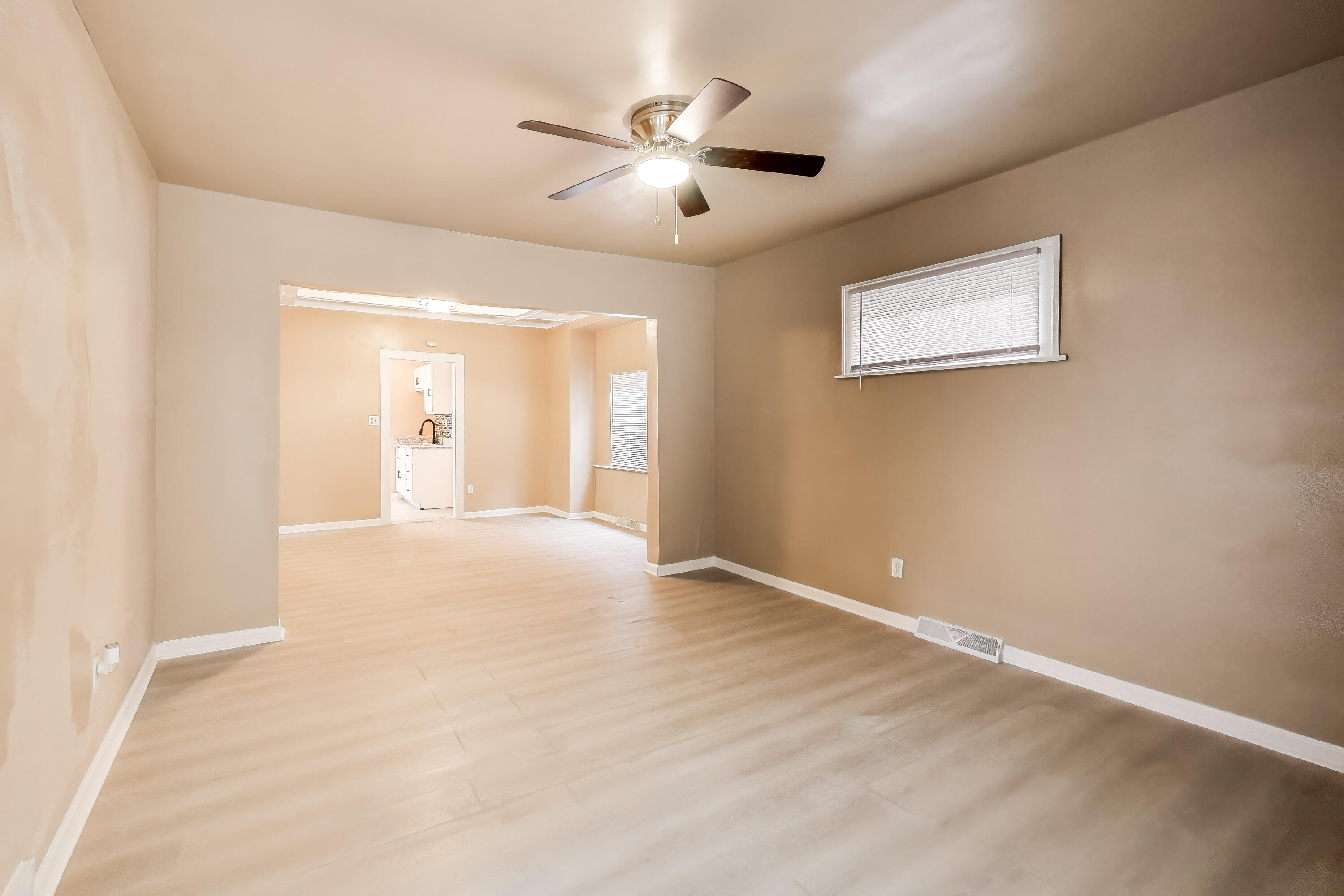 329 Pierce Street Gary, IN 46402 - Photo 4 of 17 a view of an empty room with a window