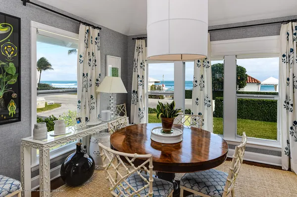 a view of a dining room with furniture window and outside view