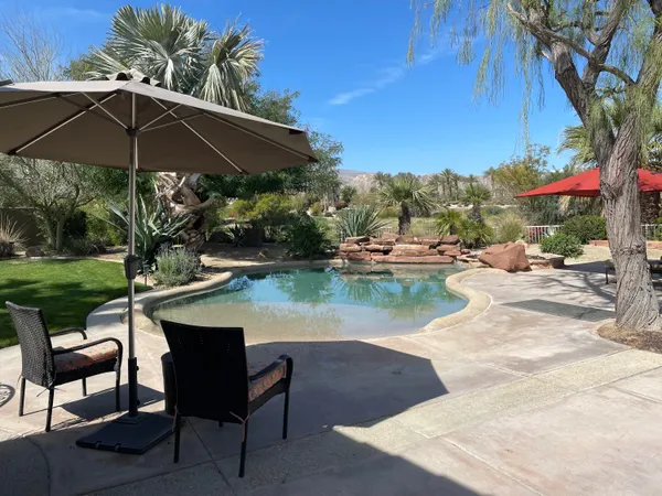 a view of a lake with outdoor space patio swimming pool and outdoor seating