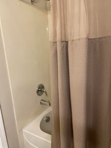 a bed room with a bed and a lamp