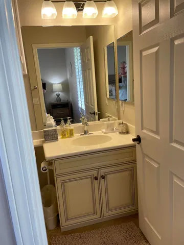 a bathroom with a shower a toilet and a sink