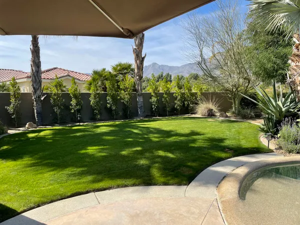 a backyard of a house with lots of green space