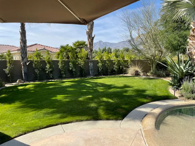 a backyard of a house with lots of green space