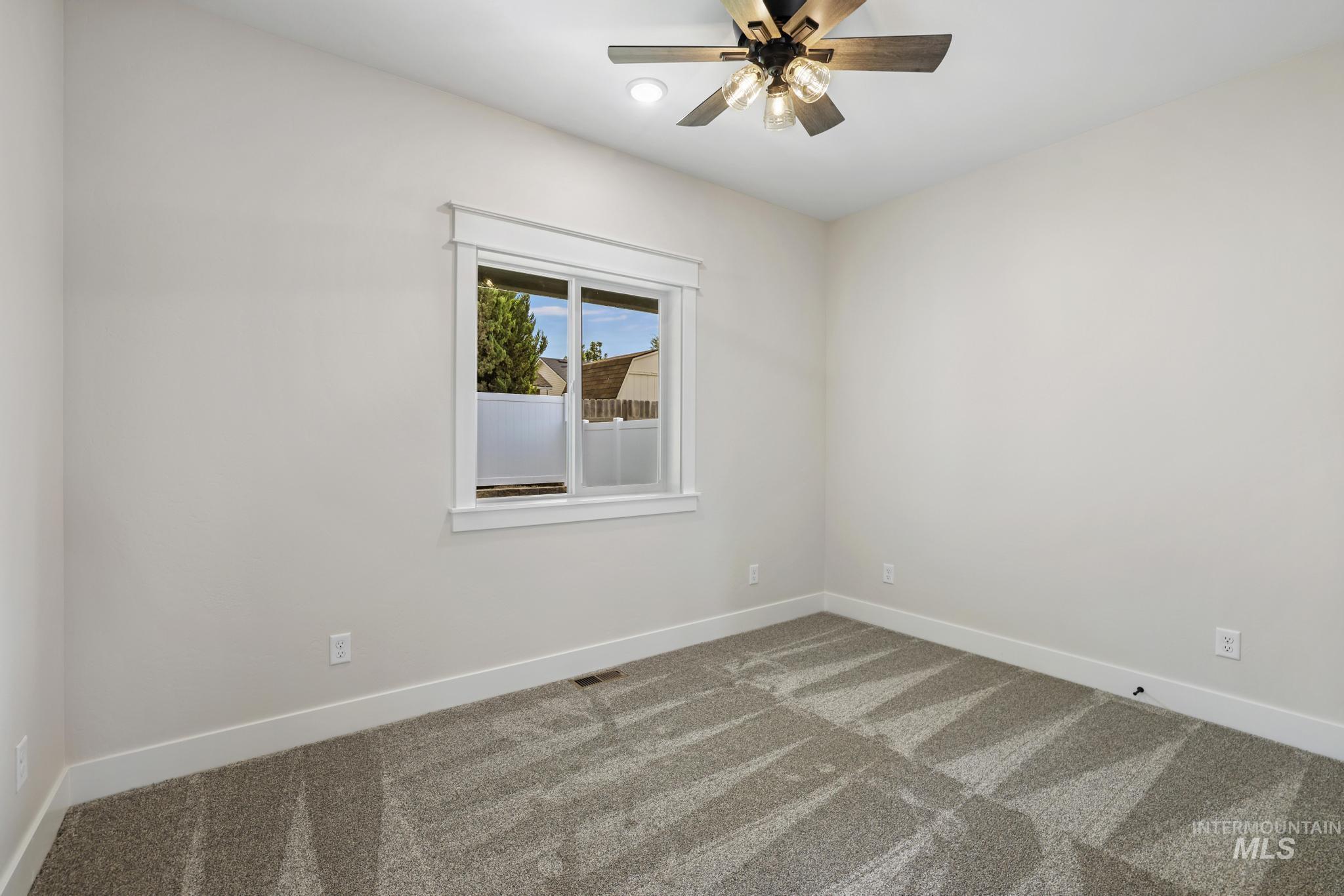 1413 Haizlee Way Twin Falls, ID 83301 - Photo 20 of 28 Carpeted empty room with baseboards and a ceiling fan