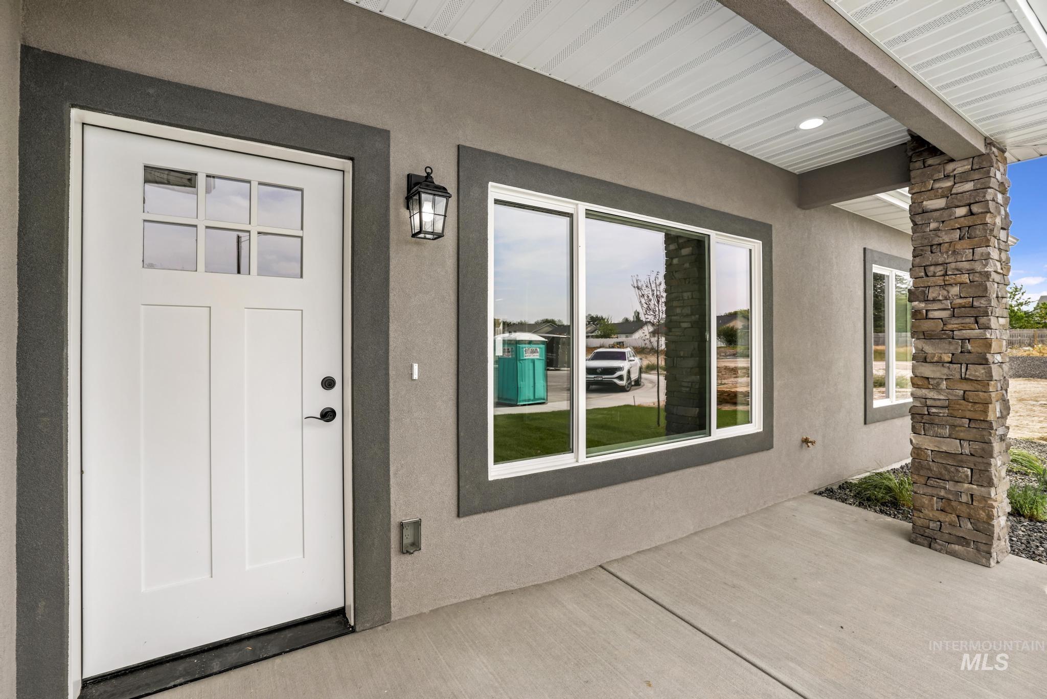 1413 Haizlee Way Twin Falls, ID 83301 - Photo 24 of 28 Doorway to property featuring stucco siding and a patio