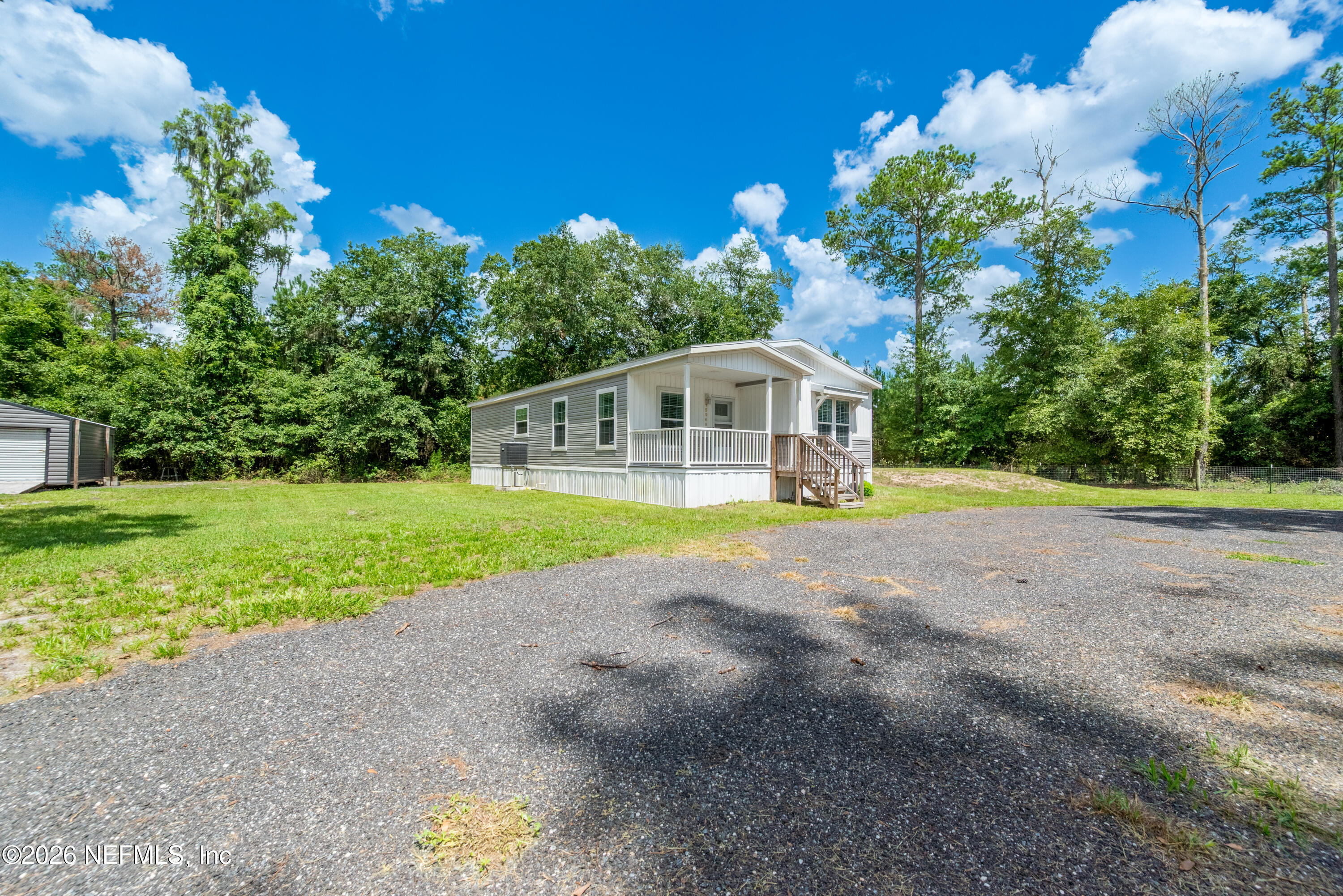 a house with swimming pool in the back