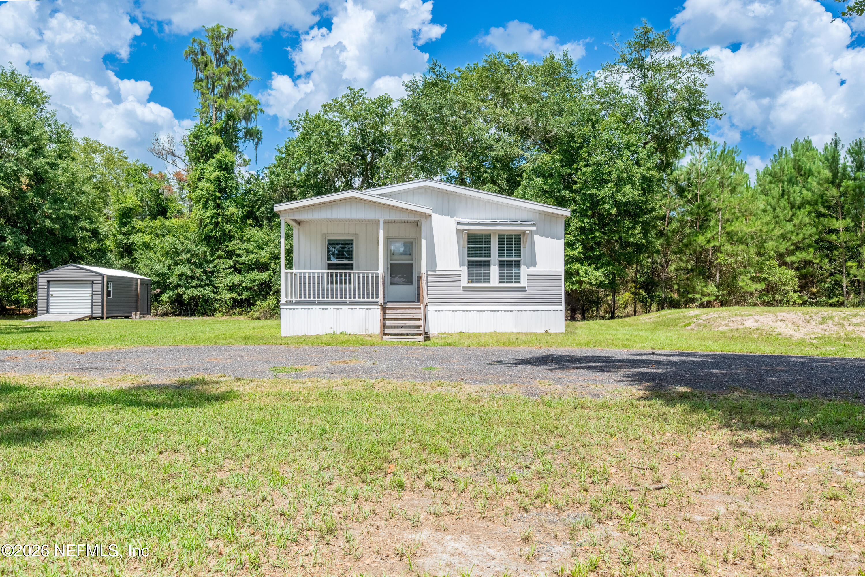 15049 Southwest 75th Avenue Starke, FL 32091 - Photo 12 of 64 a front view of a house with a yard
